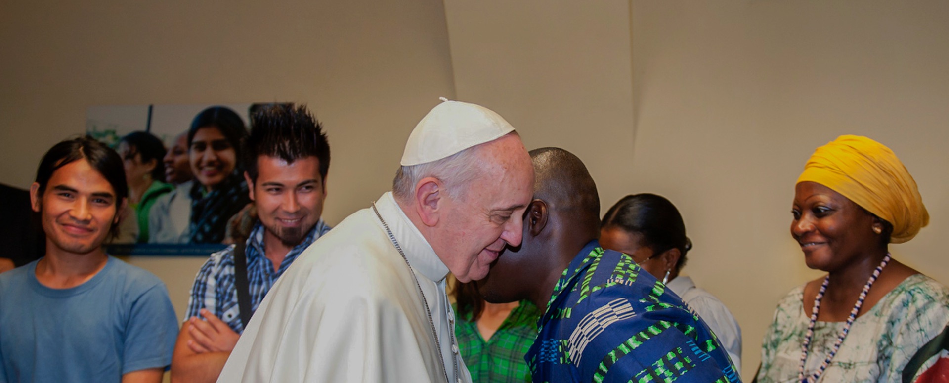 pope francis saluting Migrants and Refugees